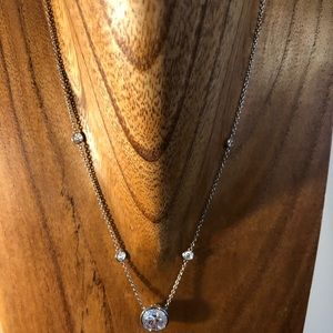 Diamonique 5 carat bezel set stone with 4 smaller stones